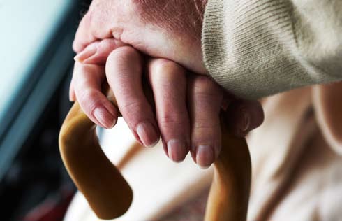 Elder's Hands holding a cane